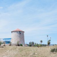 Windmill on Kastos Island, Greece by Maxeen Kim Photography