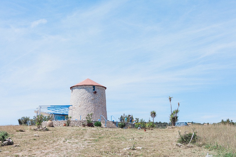 Windmill on Kastos Island, Greece by Maxeen Kim Photography