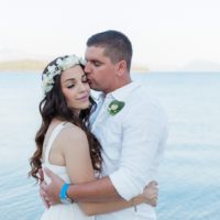 Bride and Groom Hugging After Their Seaside Elopement