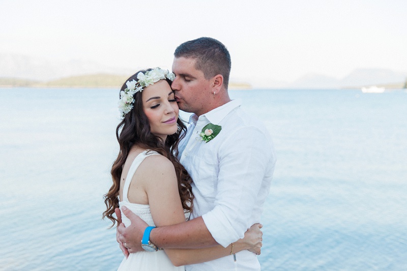 Bride and Groom Hugging After Their Seaside Elopement