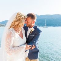 Bride and Groom Against Blue Greek Sea