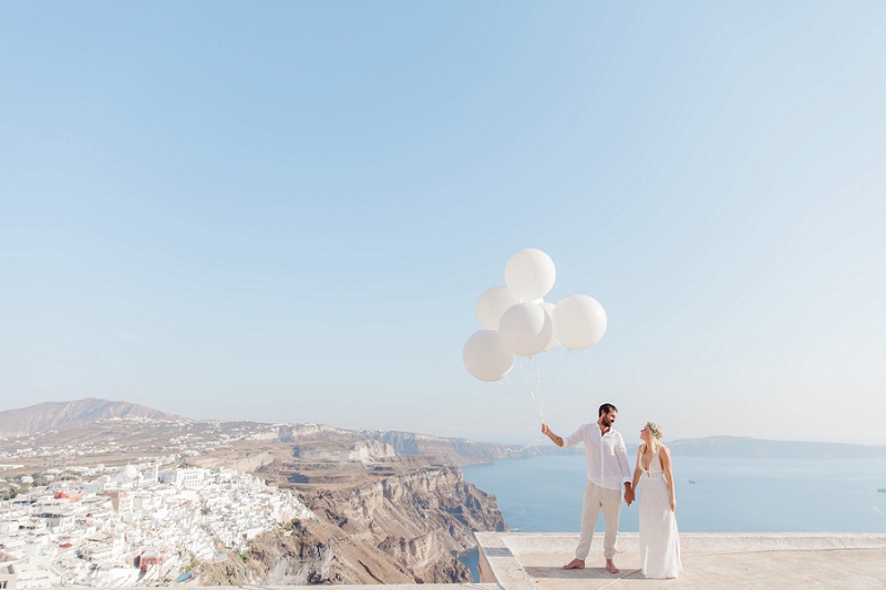 Bride and Groom with Giant White Balloons During their Santorini Elopement