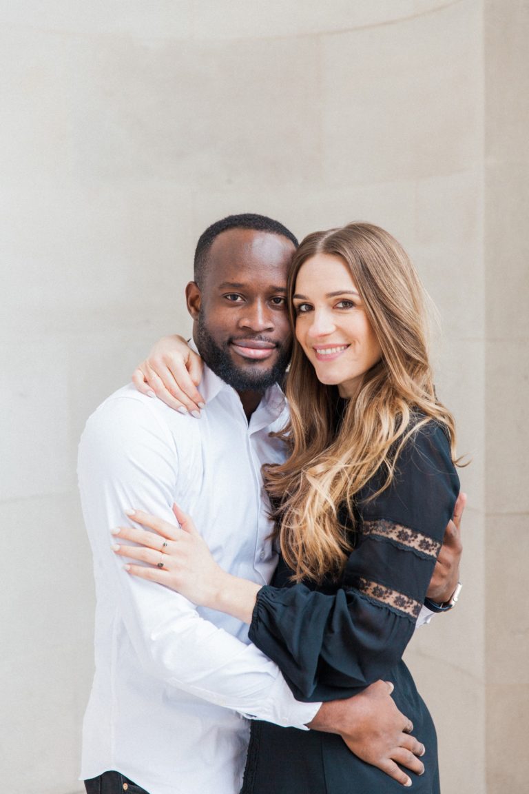 Couple hug during their engagement shoot at the Landmark Hotel London