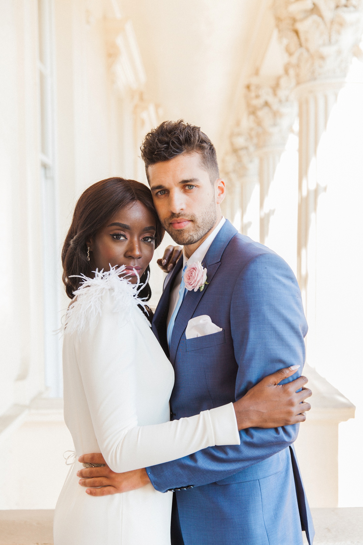 Portrait of a black bride and a white groom on the balcony during their 10-11 Carlton House Terrace wedding in London