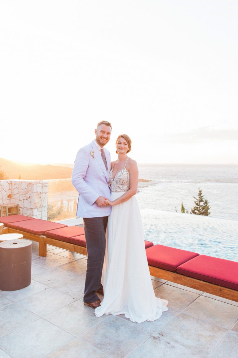 Bride and groom on the patio during their Emelisse Hotel wedding on Kefalonia in Greece