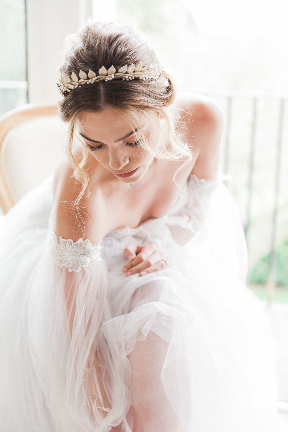 Bride putting on her shoes at Froyle Park wedding venue in the UK