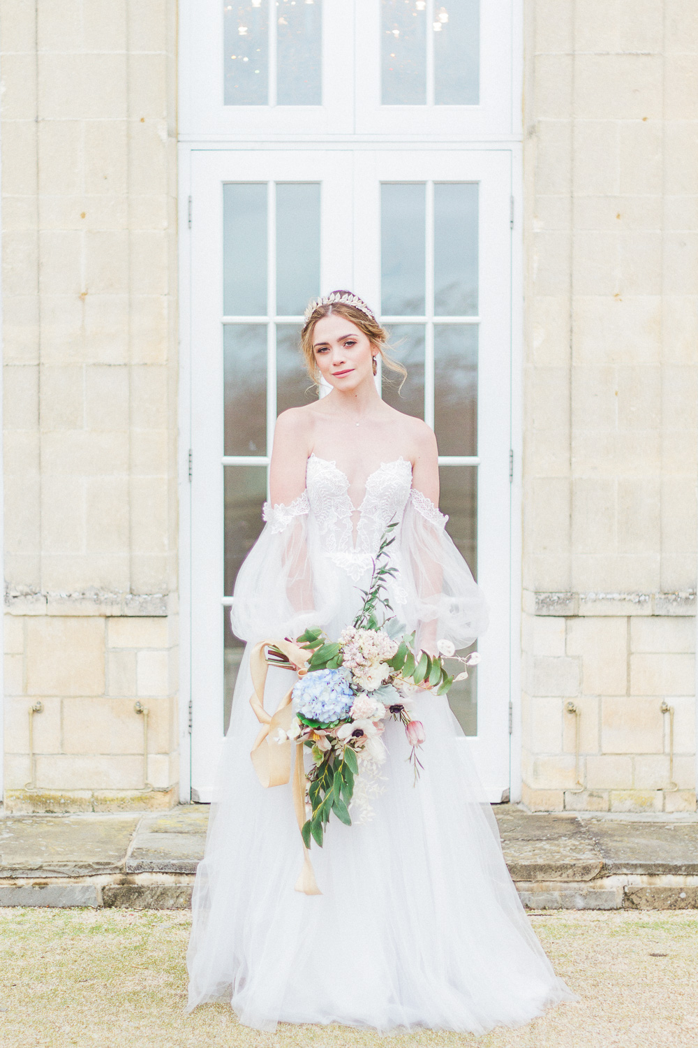 Bride with a spring bouquet at Froyle Park wedding venue in the UK
