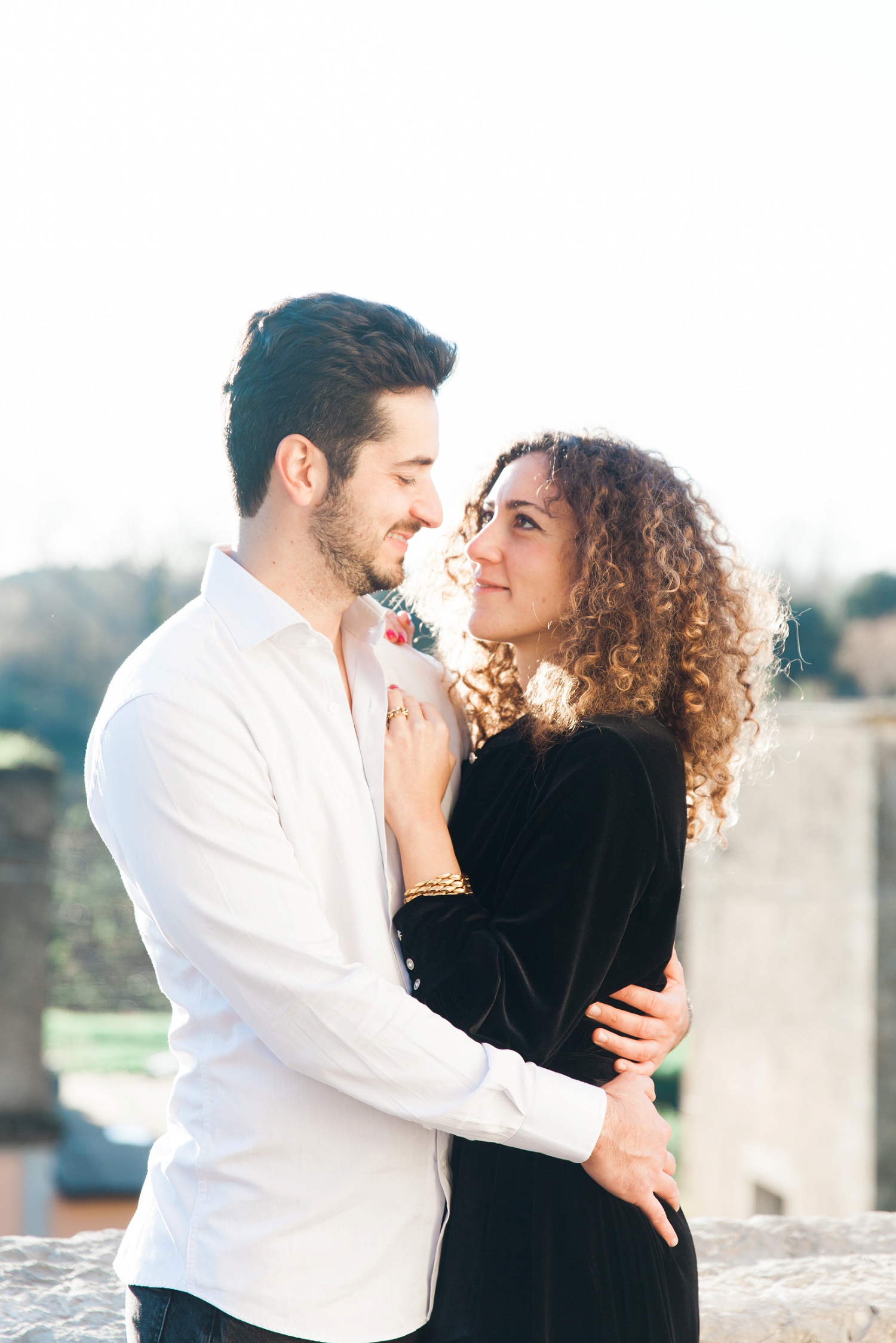 Couple smile at each other during their Italian countryside couple photography session