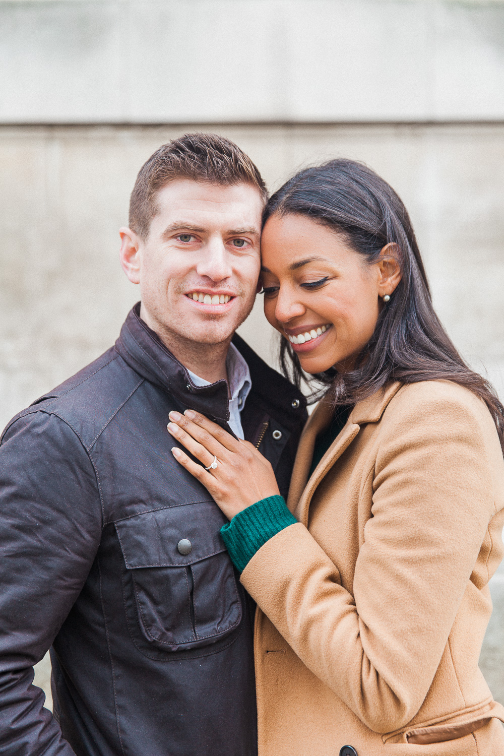 Couple hug during their autumn engagement shoot in London