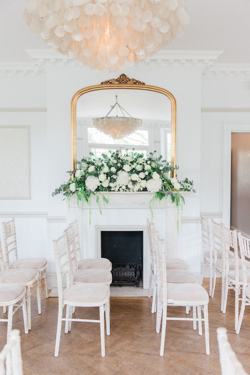 Decorated fireplace in the indoor ceremony room of Belair House wedding venue in London