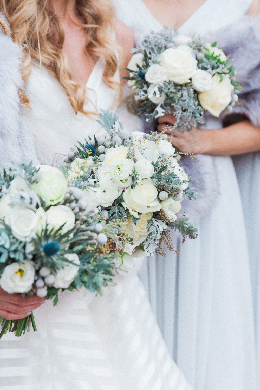Bride and bridesmaids winter wedding bouquets in white and blue by London wedding photographer Maxeen Kim