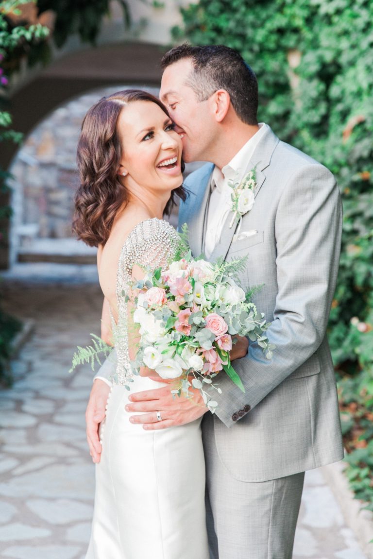 Portrait of a happy couple on thier wedding day at Domotel Agios Nikolaos in Sivota