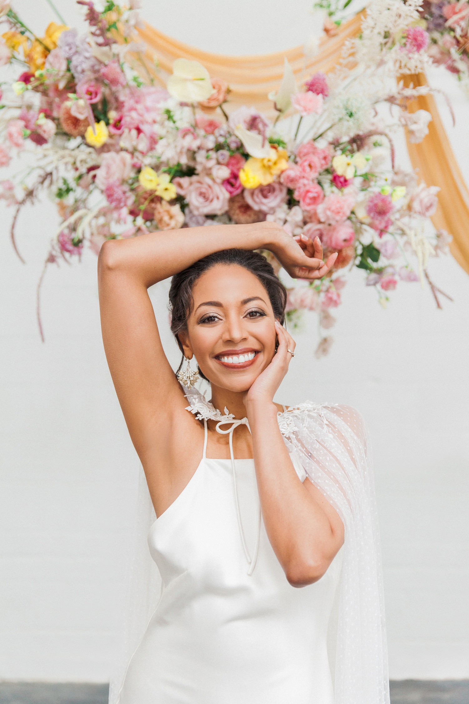 Colourful spring wedding editorial in London featuring a beautiful mixed race bride