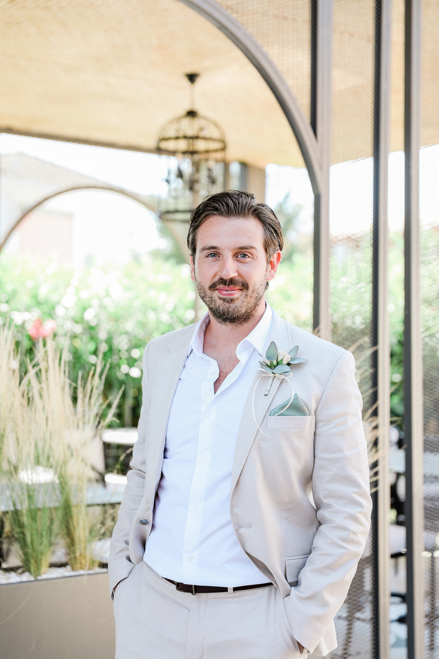 Groom wearing a stone coloured suit from Asos Man at Parga Beach Resort