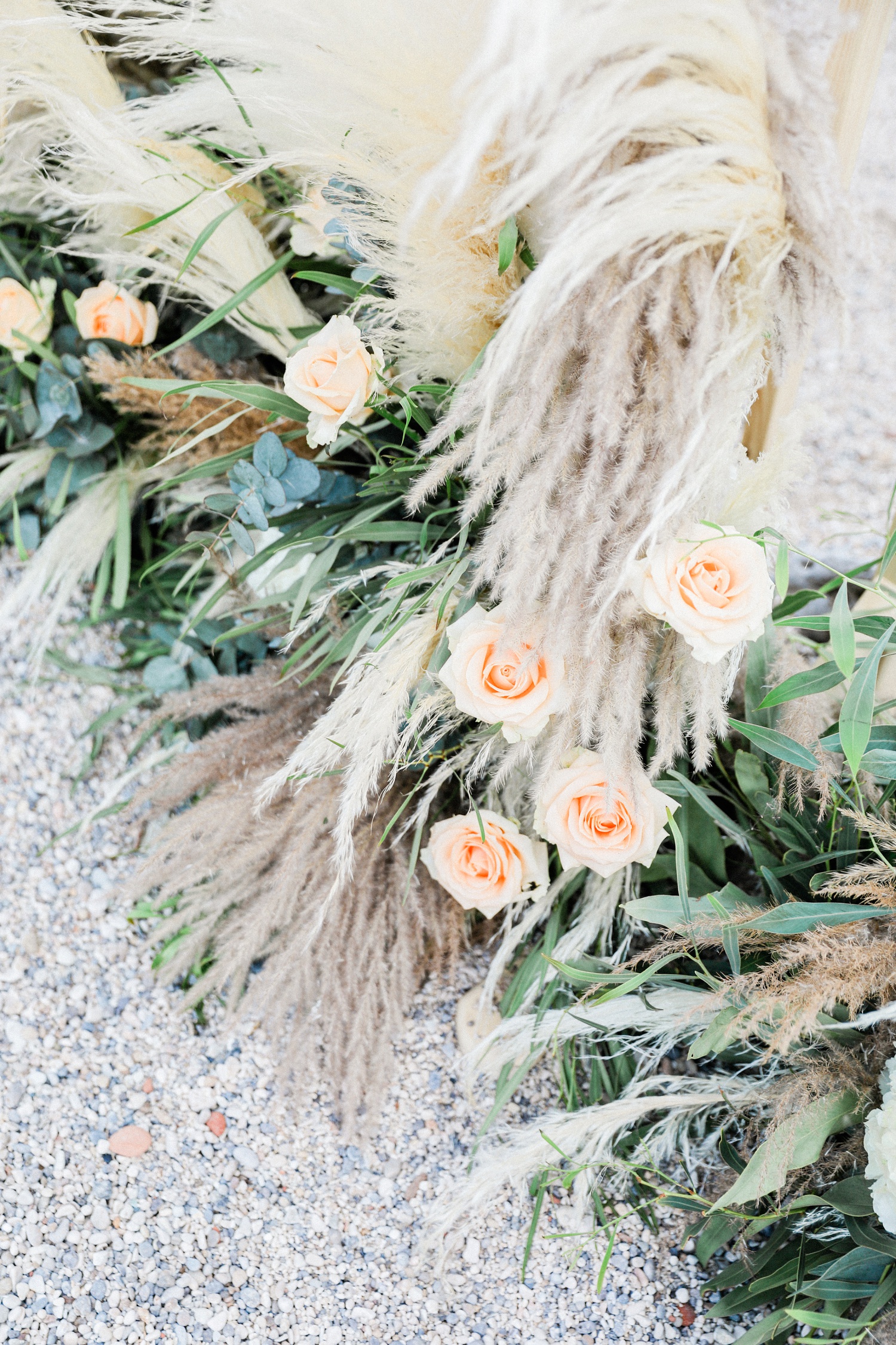 Boho pampas and peach rose decor at a beach wedding in Parga