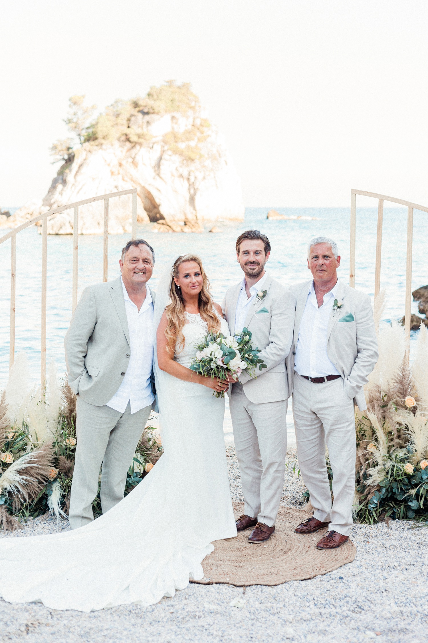 Bridal party wearing neutral tones at a beach wedding in Parga