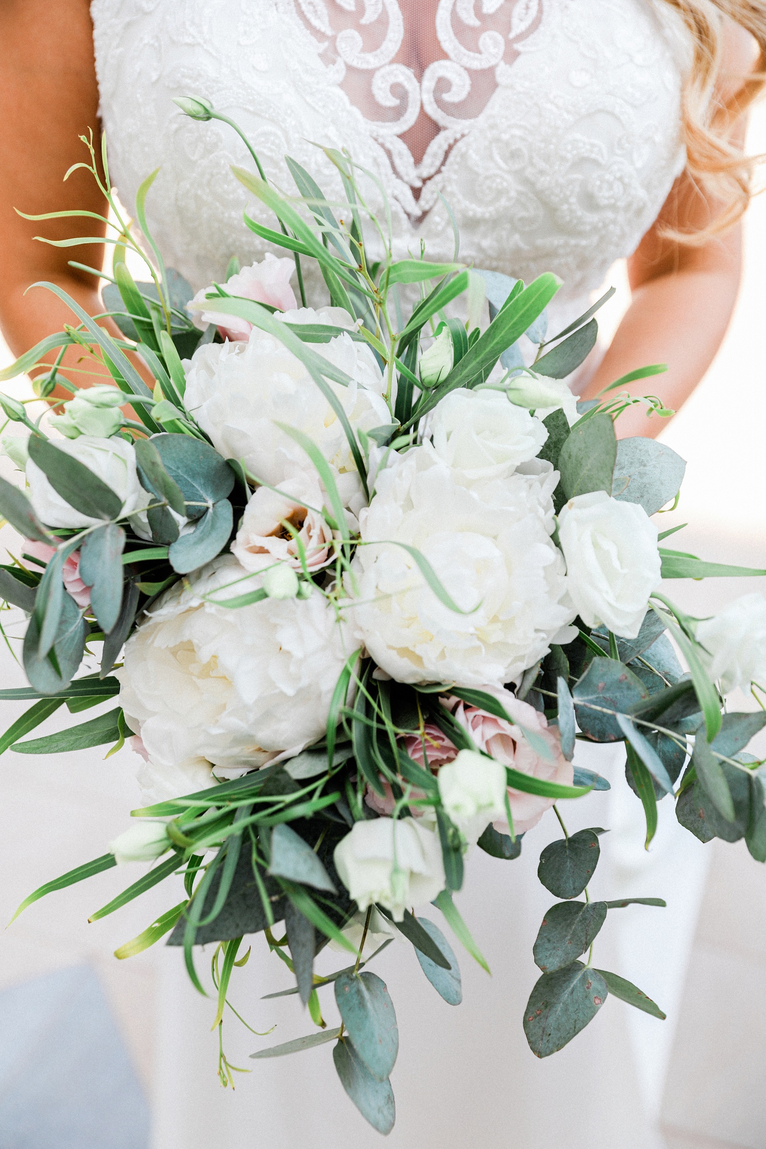 Bridal bouquet with eucalyptus and white peonies