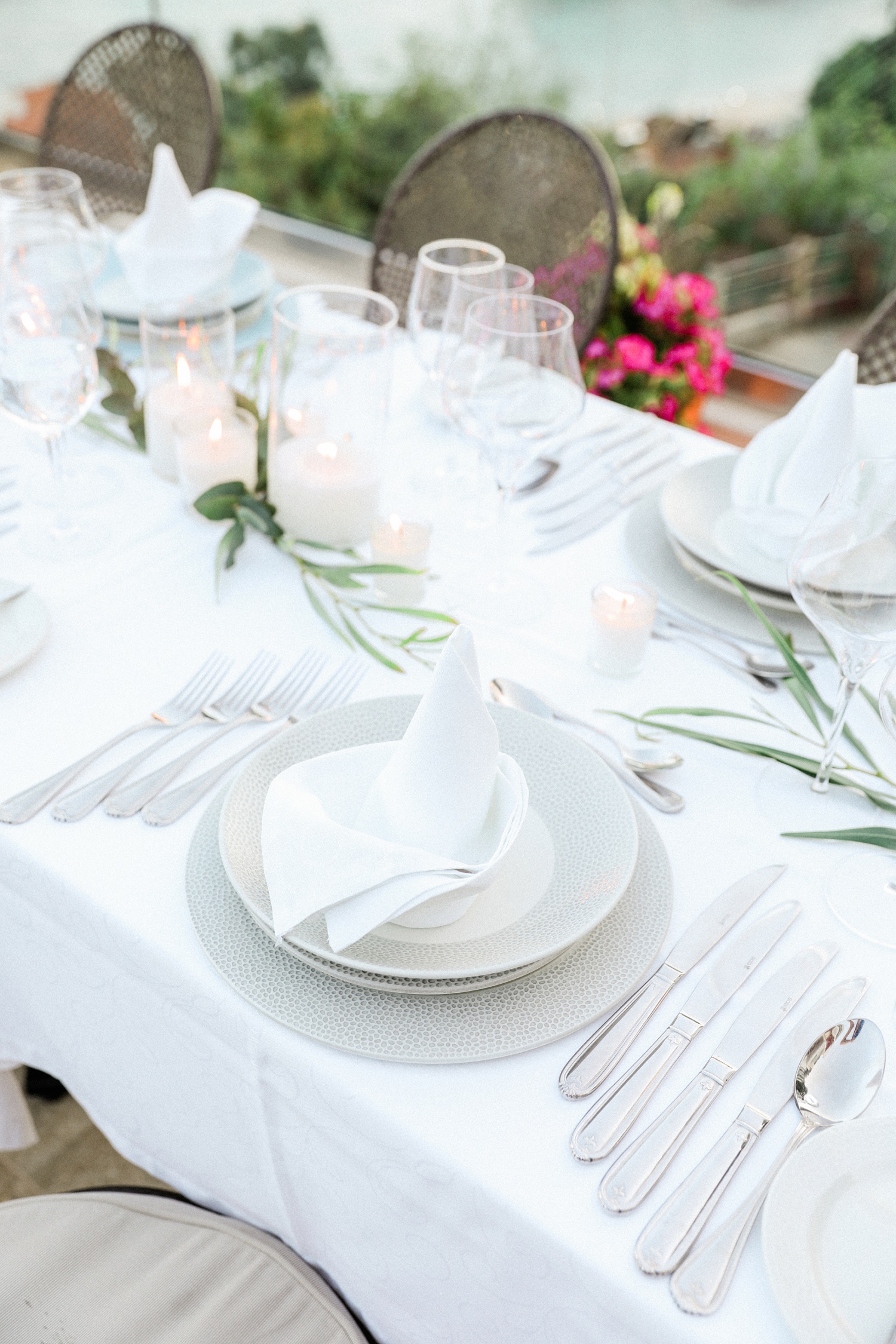 Guests table setting in white and grey at Irida Boutique Hotel wedding