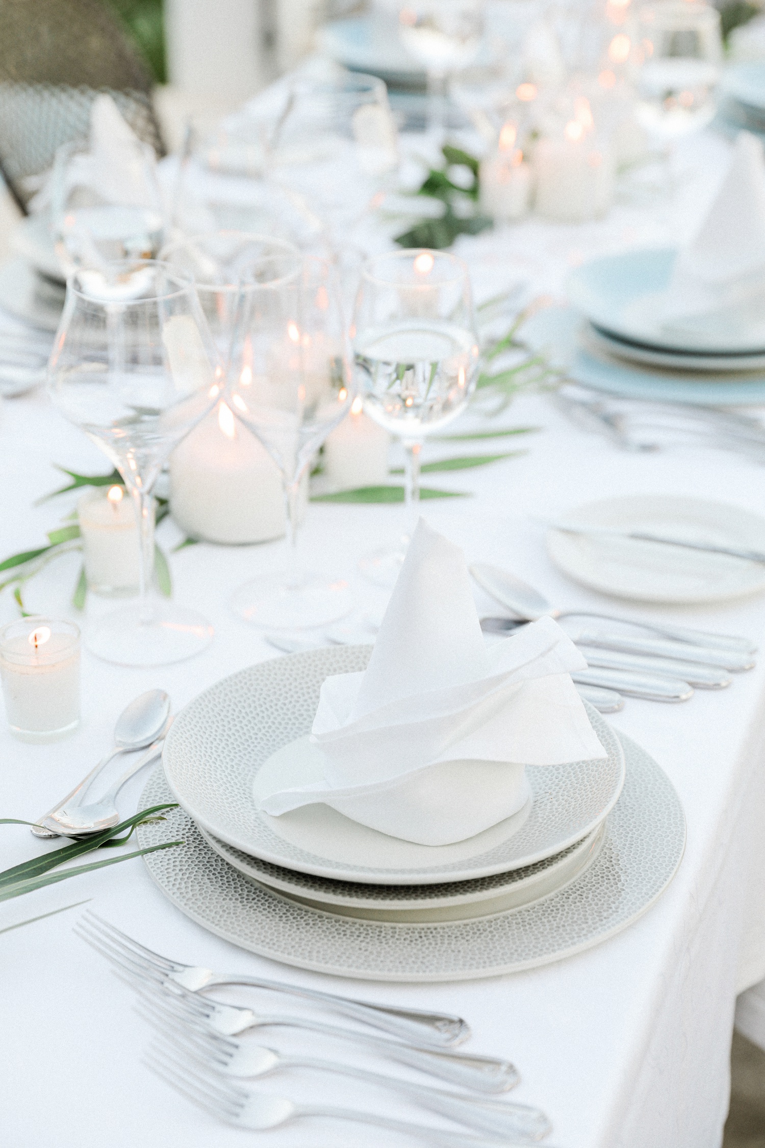 Minimal guest table setting in neutral tones at Irida Boutique Hotel wedding