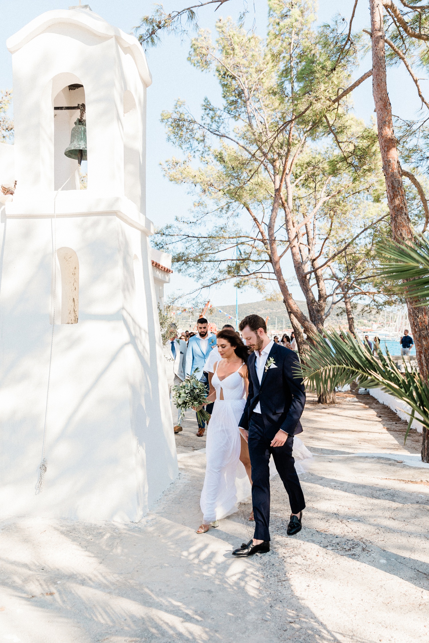 Couple followed by their guests make their way to the door of the Orthodox church on Lazaretto Islet