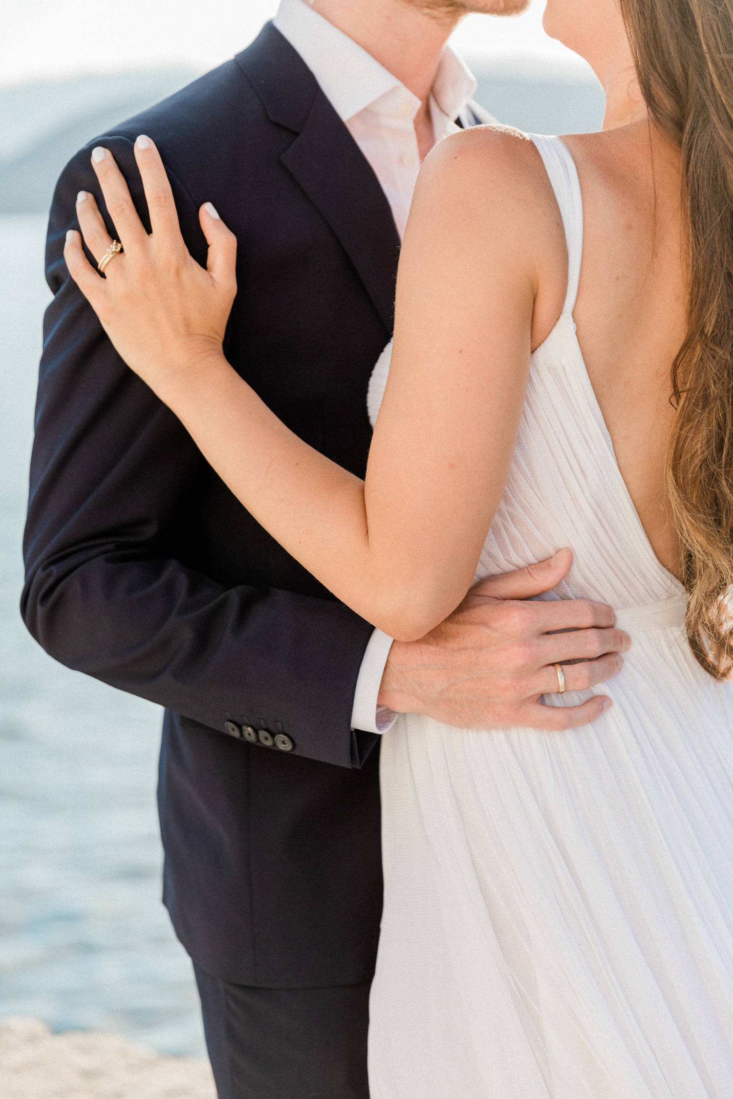 Detail image of a bride wearing a Ruth Tomlinson diamond cluster engagement ring