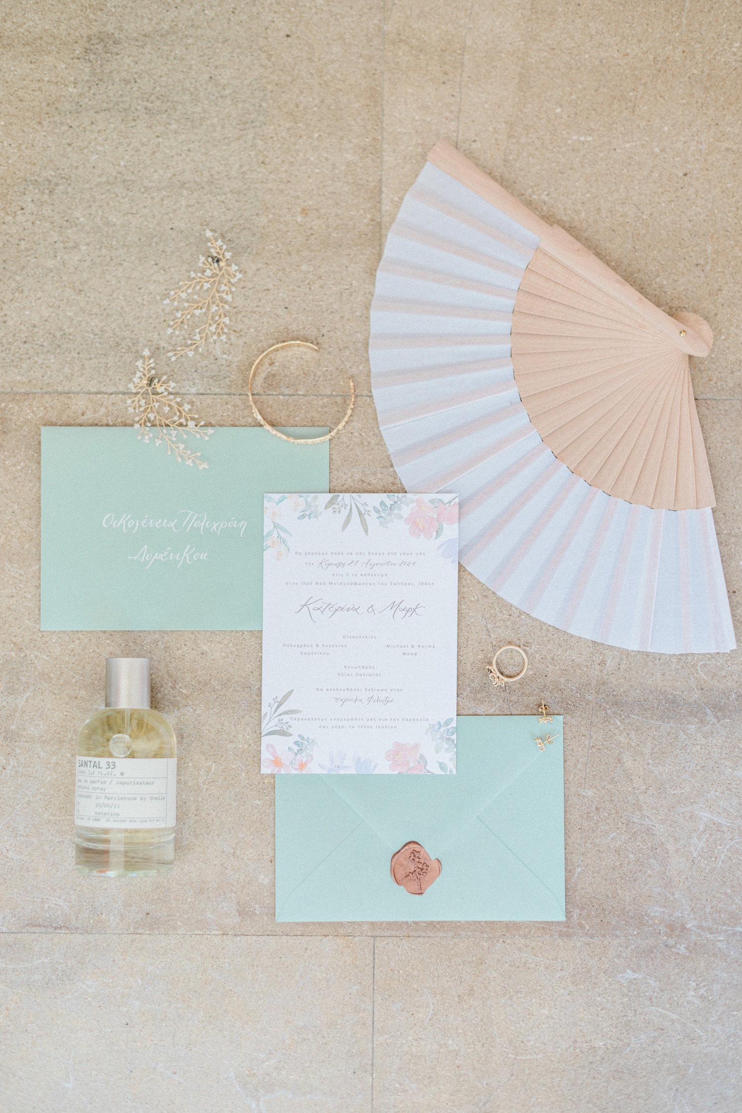 Bridal details including pastel wedding stationery by Chiaramada Studio, Ruth Tomlinson engagement ring and Le Labo fragrance