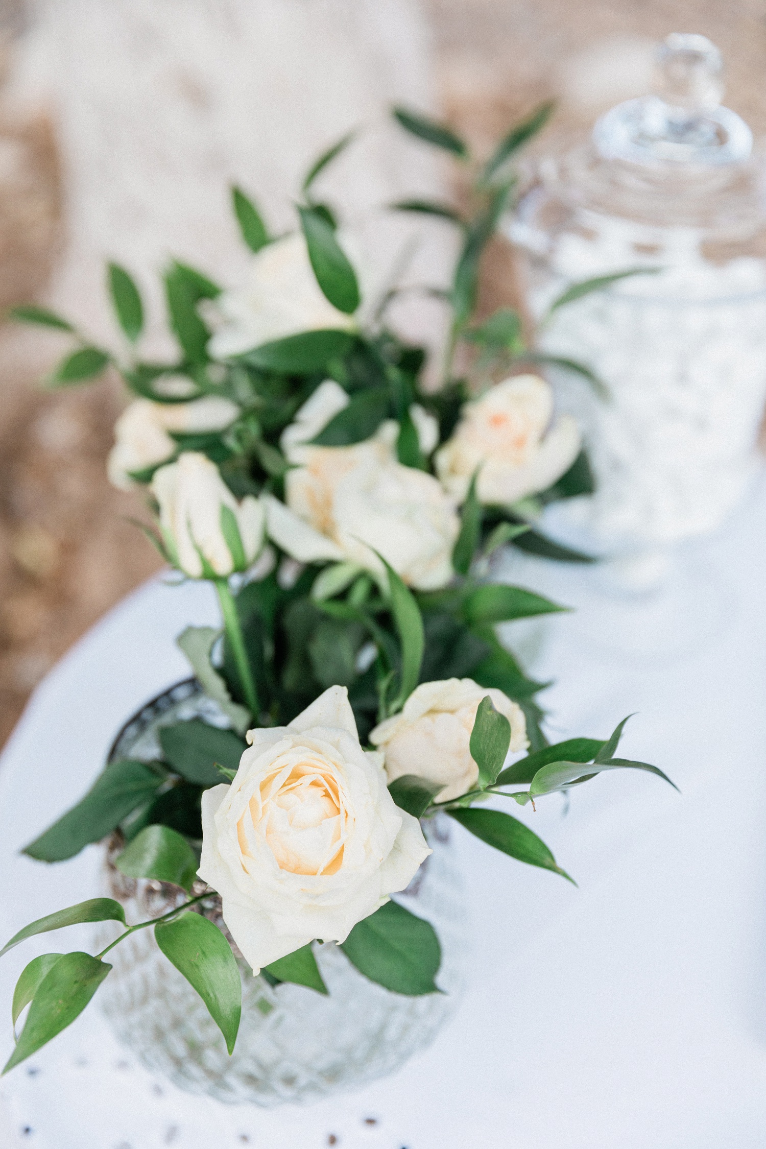 White rose and greenery wedding flowers at Kirki on Filiatro beach in Ithaca