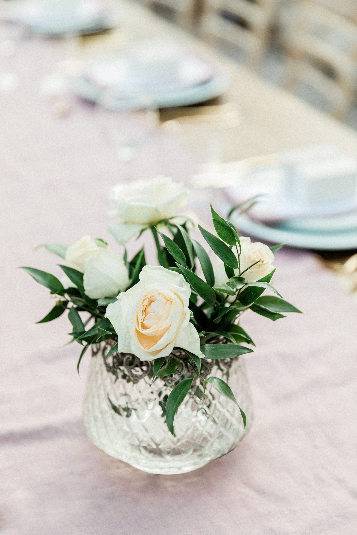 White and green centerpiece at a wedding at Kirki on Filiatro beach