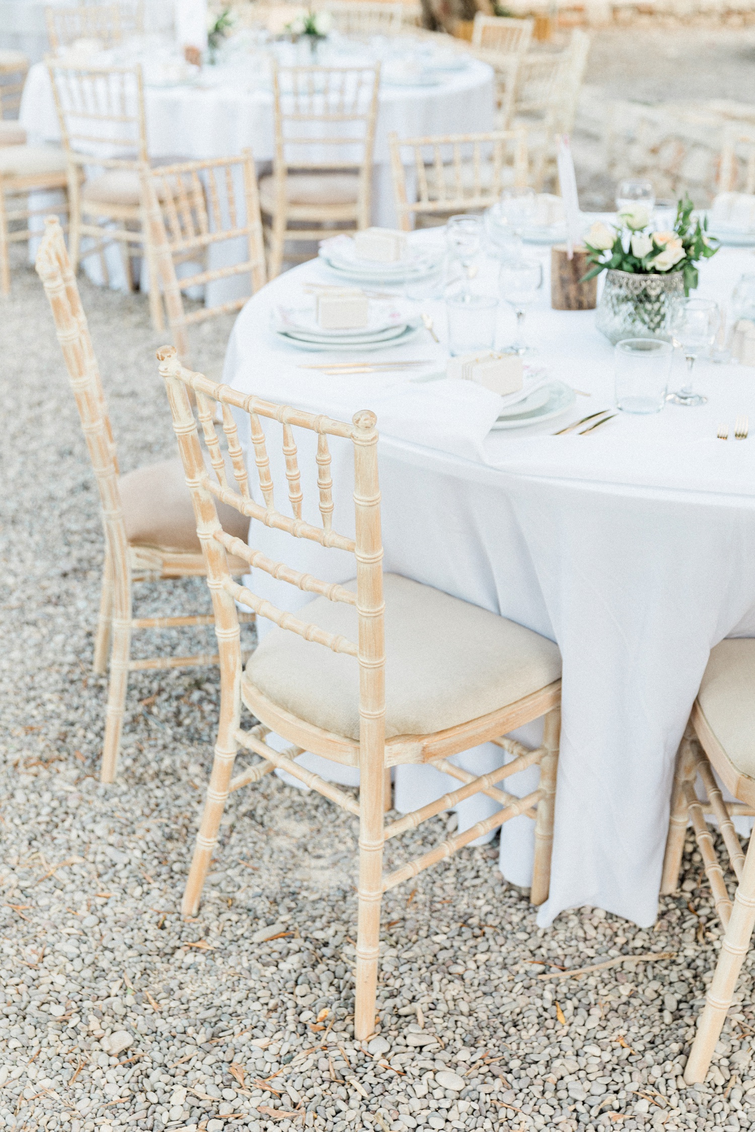 Cream chairs at an olive grove wedding at Kirki on Filiatro beach in Ithaca
