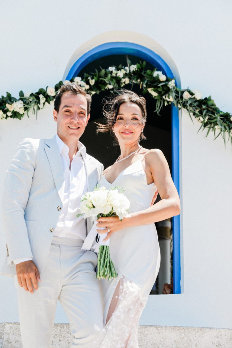 Couple stand in front of Agios Andreas church on Ithaca