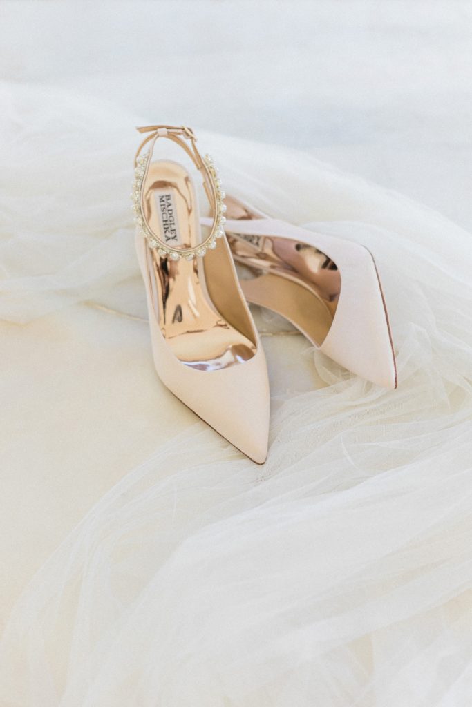 Nude Badgley Mischka heels with pearl ankle details on the brides veil