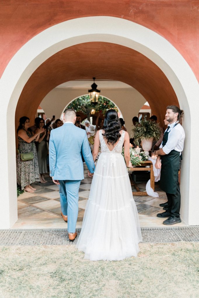 Couple making arrive at their wedding reception at Villa Veneziano